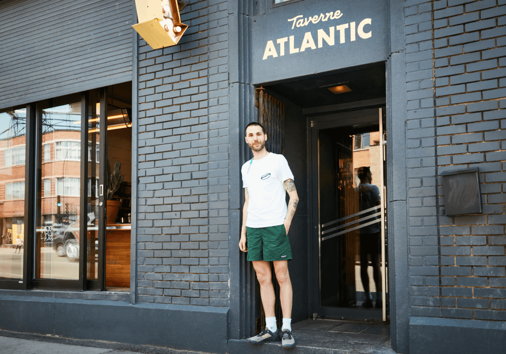 The owner of Taverne Atlantic at the entrance to the restaurant