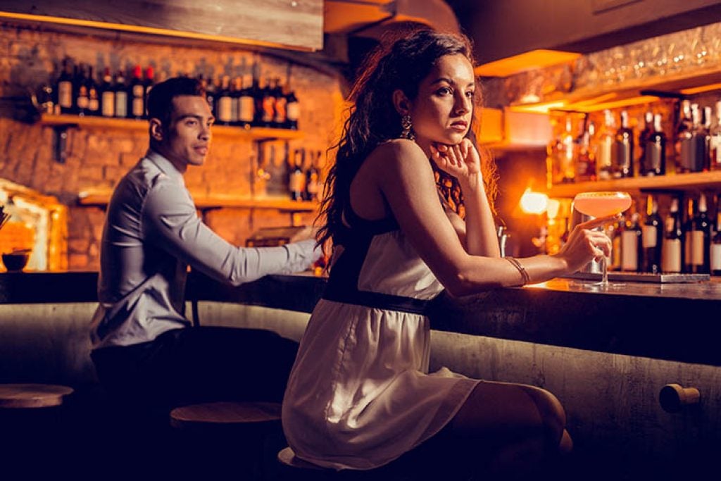 Woman at Bar Alone