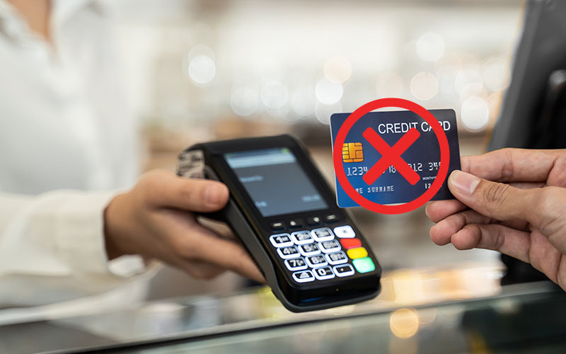 A merchant services provider helping a business owner to implement a cash discount program