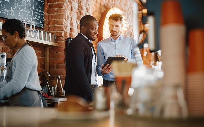 Restaurant owner engaging with local community