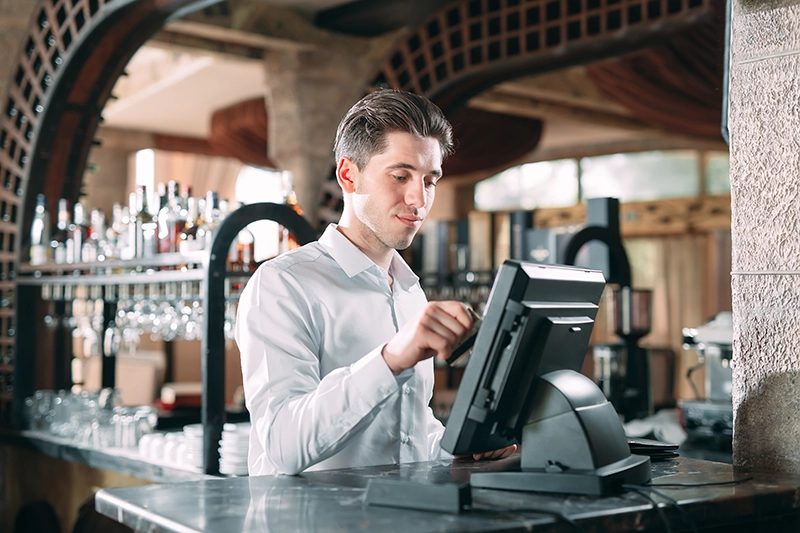 Bartender Accepting Payment at the Point of Sale